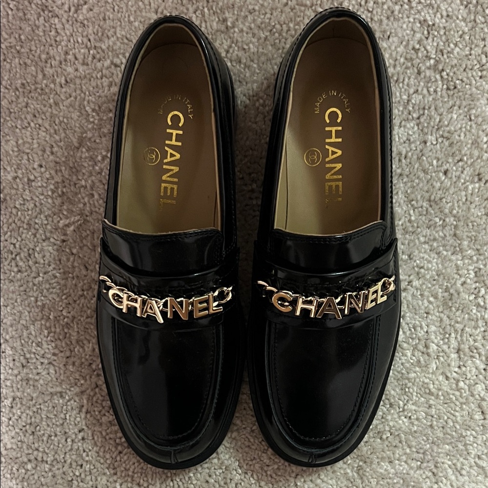 CHANEL Black Patent Leather Loafers with Gold Accent